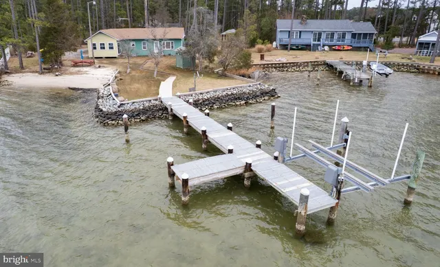 a swimming pool with outdoor seating and yard