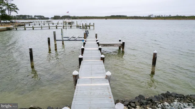 a swimming pool with outdoor seating and yard