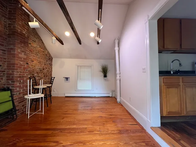 a view of a livingroom with furniture and wooden floor
