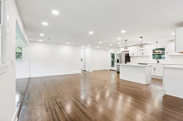 a kitchen with granite countertop a sink and appliances