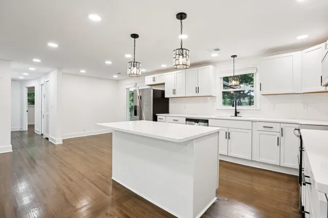 a bathroom with a sink a toilet and a bathtub