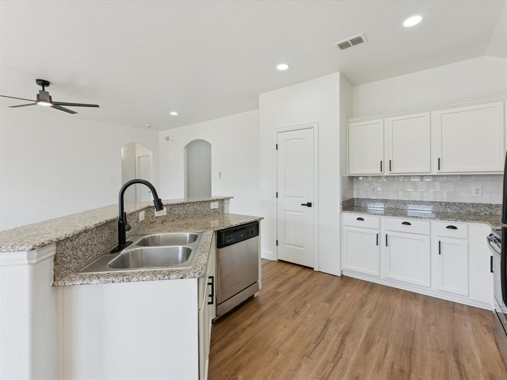 810 Ranch Road Dallas, TX 75253 - Photo 20 of 28 Kitchen featuring white cabinetry, appliances with stainless steel finishes, a ceiling fan, and recessed lighting