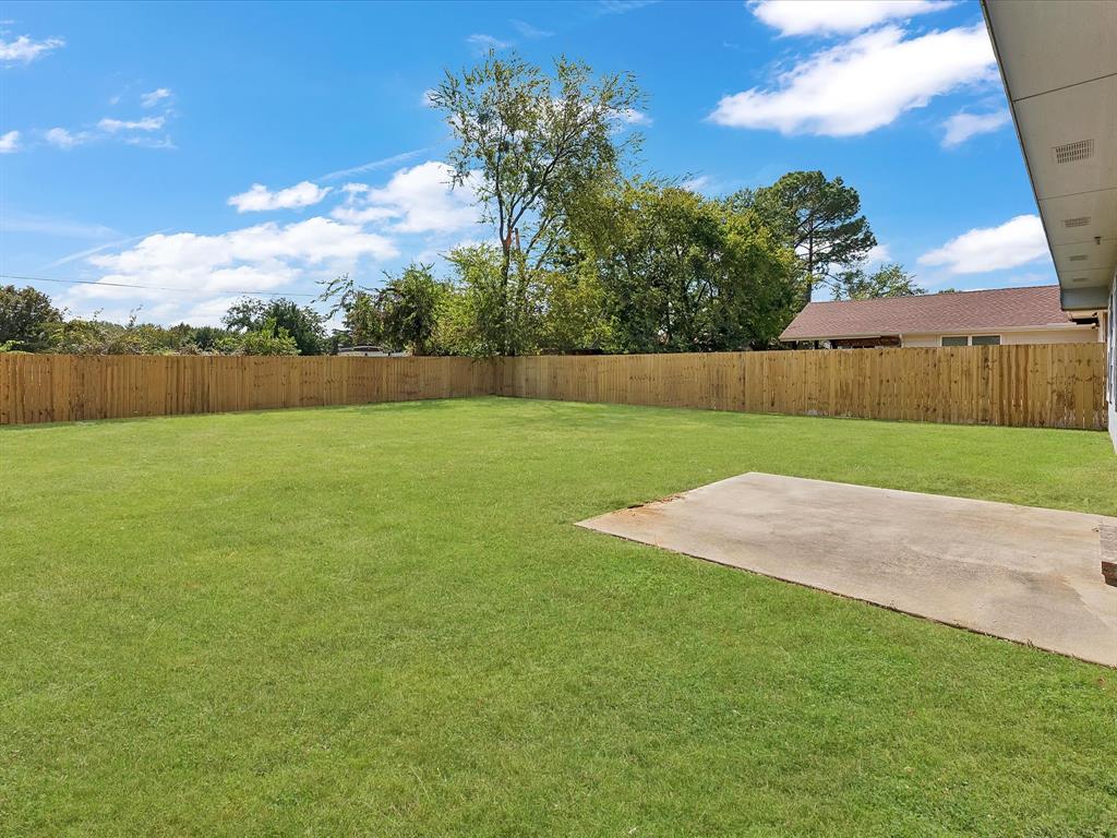 810 Ranch Road Dallas, TX 75253 - Photo 25 of 28 Fenced backyard with a patio