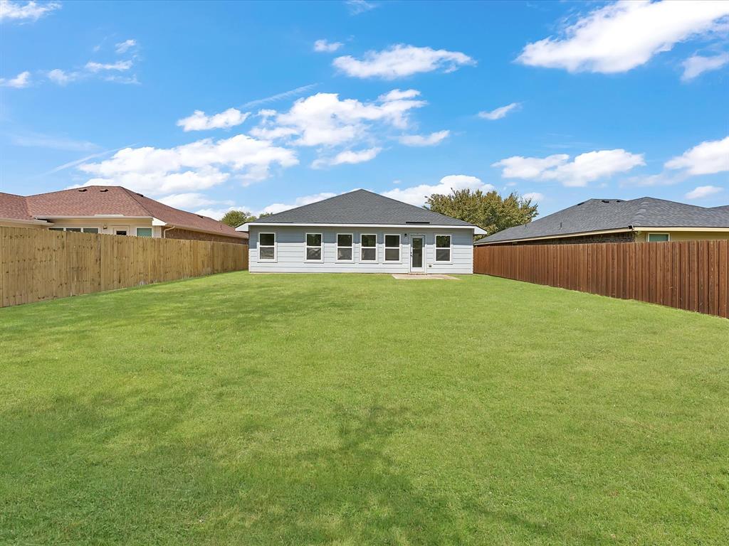 810 Ranch Road Dallas, TX 75253 - Photo 26 of 28 Back of house featuring a fenced backyard and a patio area