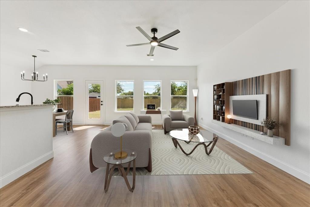 810 Ranch Road Dallas, TX 75253 - Photo 3 of 28 Living room with light wood finished floors, a chandelier, and ceiling fan