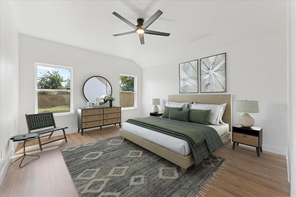 810 Ranch Road Dallas, TX 75253 - Photo 6 of 28 Bedroom featuring lofted ceiling, a ceiling fan, and wood finished floors