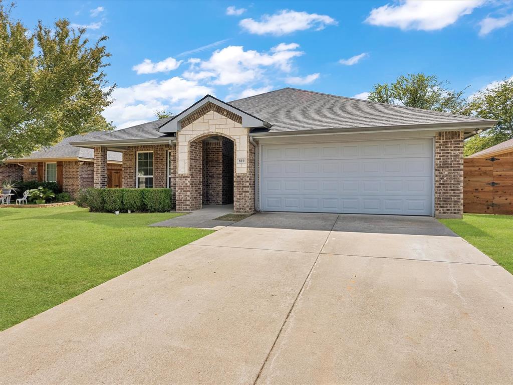810 Ranch Road Dallas, TX 75253 - Photo 7 of 28 View of front of property with brick siding, a front yard, and a shingled roof