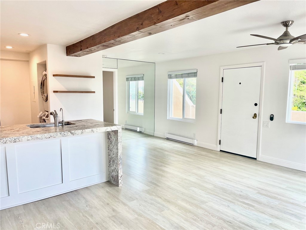 352 Y Place Laguna Beach, CA 92651 - Photo 11 of 22 a view of an empty room with window and wooden floor