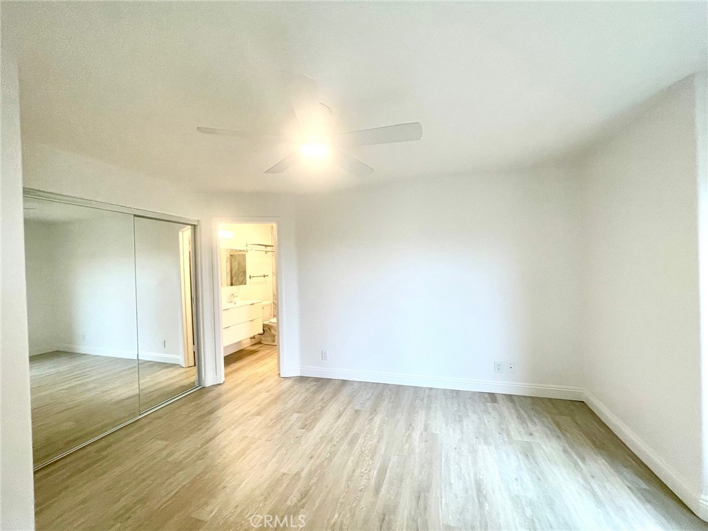 352 Y Place Laguna Beach, CA 92651 - Photo 12 of 22 an empty room with wooden floor and windows