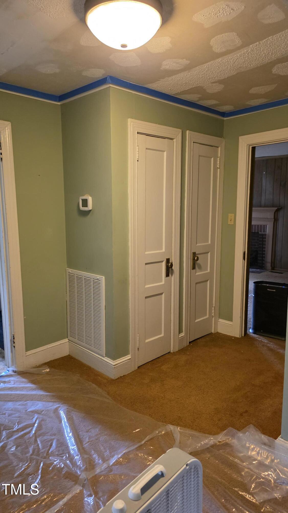 1015 Wait Avenue Wake Forest, NC 27587 - Photo 12 of 19 a view of a livingroom with wooden floor and kitchen space