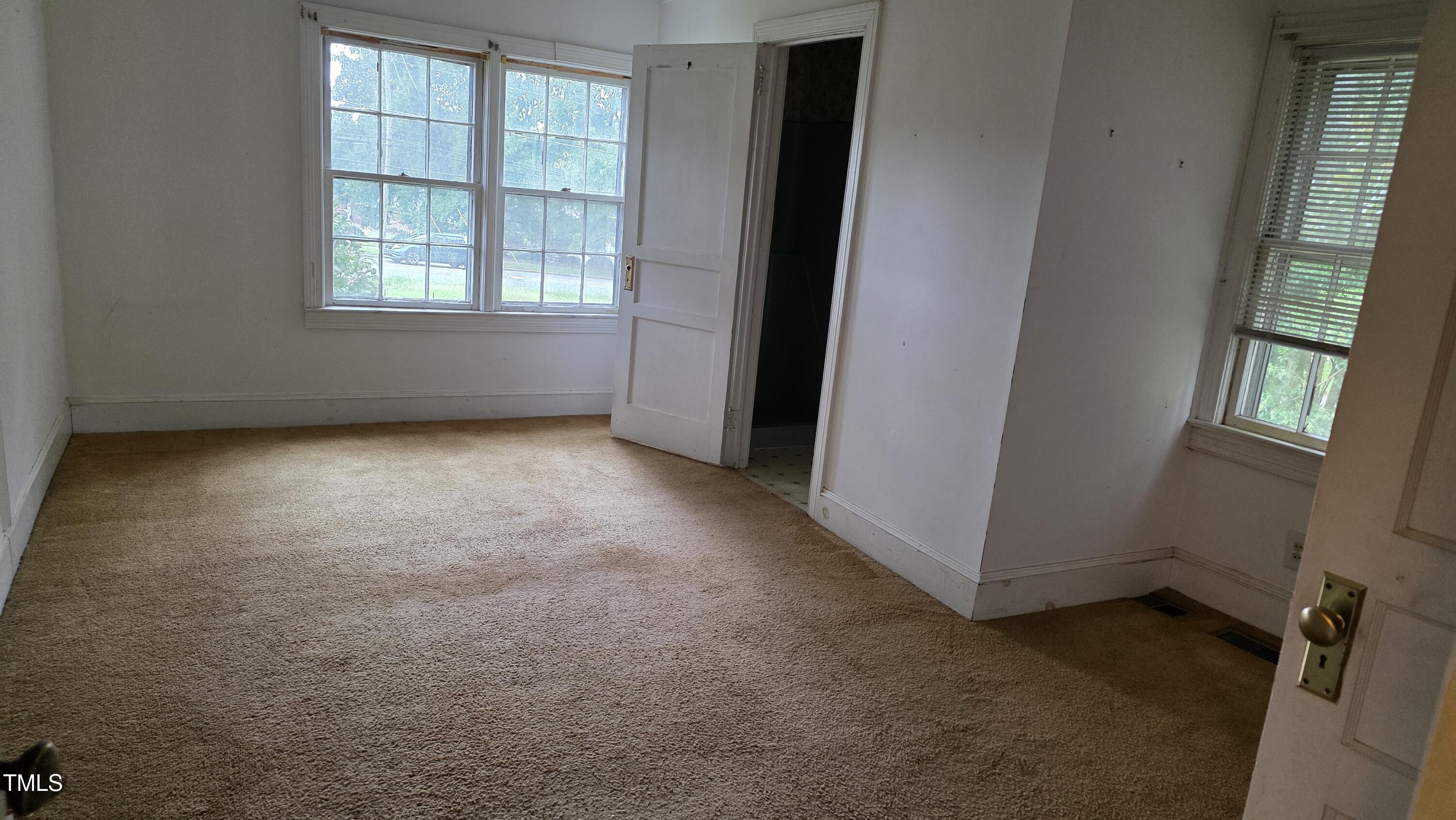1015 Wait Avenue Wake Forest, NC 27587 - Photo 15 of 19 an empty room with windows