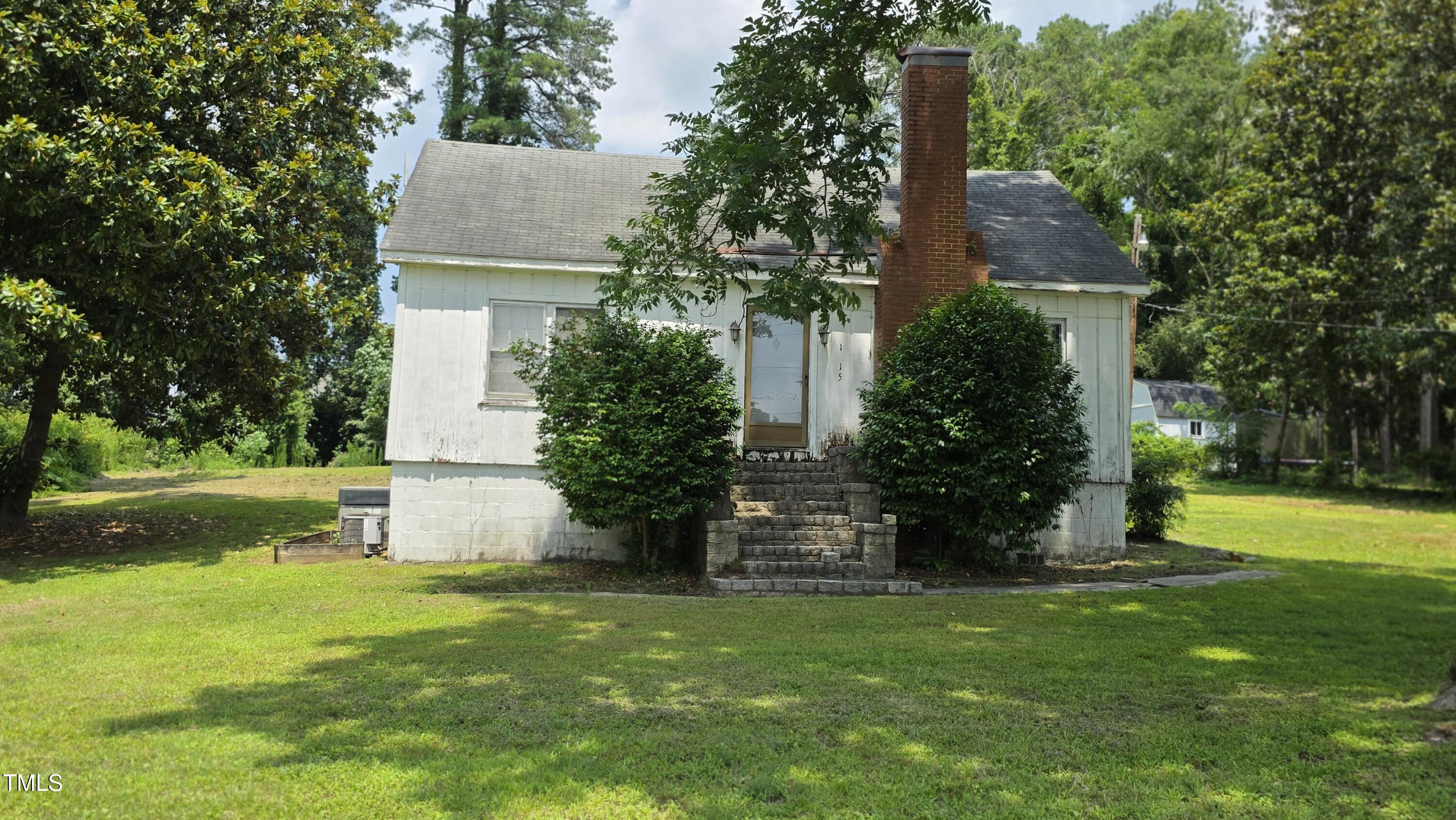 1015 Wait Avenue Wake Forest, NC 27587 - Photo 2 of 19 a front view of a house with garden