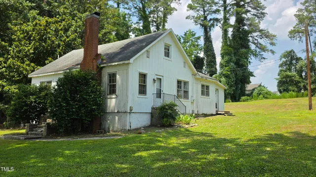 a view of an empty room with a fireplace