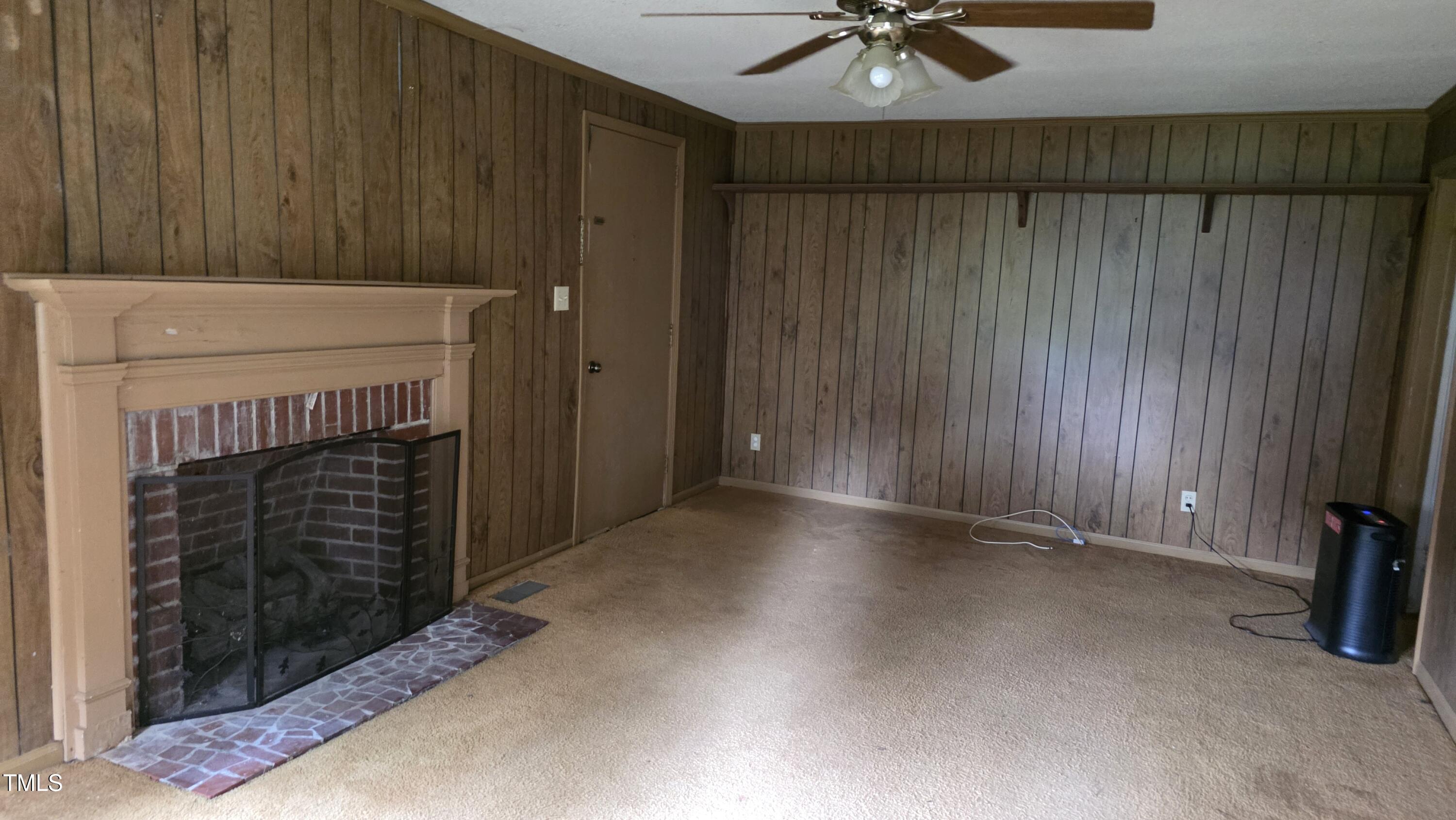 1015 Wait Avenue Wake Forest, NC 27587 - Photo 8 of 19 a view of an empty room with a fireplace