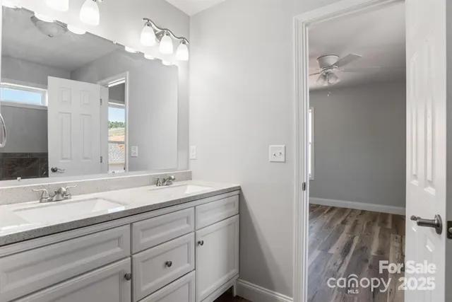 a bathroom with a sink a vanity and a mirror