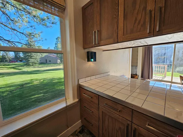 a room with a large window and doors