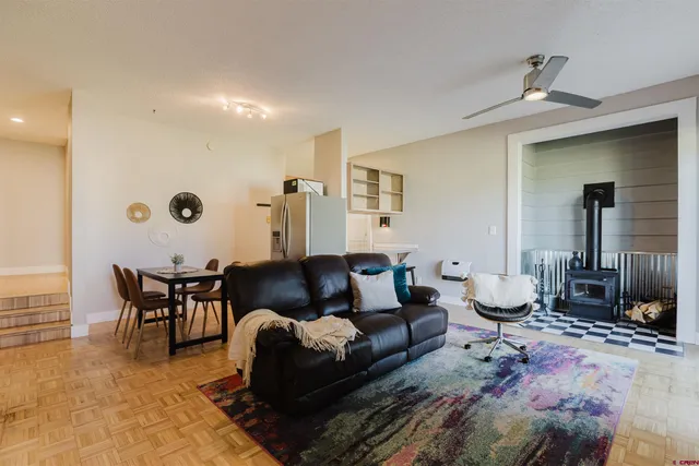 a living room with furniture and a rug