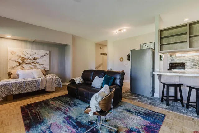 a spacious bathroom with a sink and a floor to ceiling window