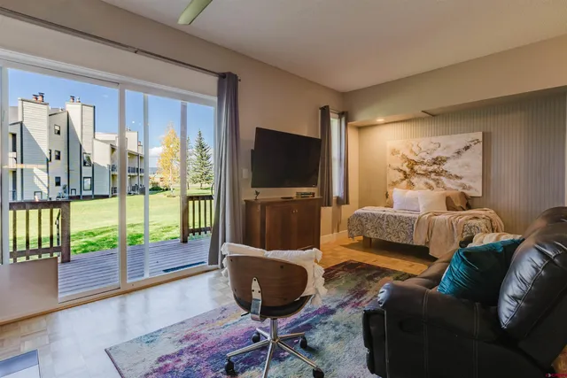 a view of balcony with wooden floor
