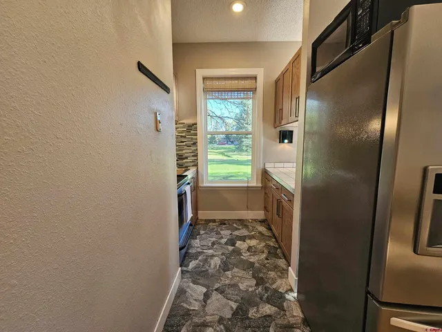a bathroom with a shower and a toilet