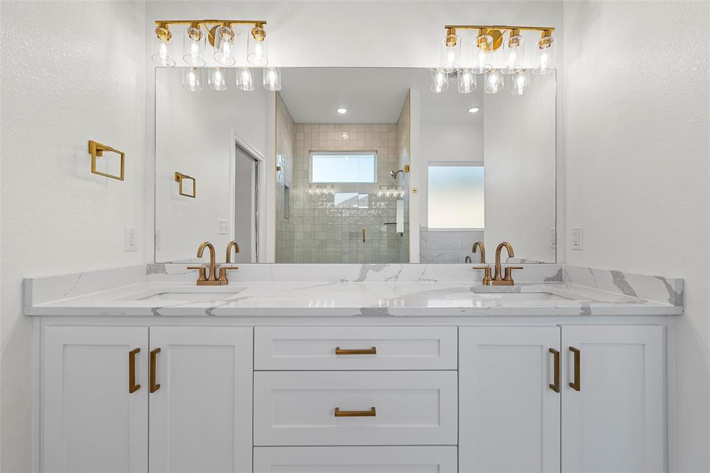912 Gallant Fox Hewitt, TX 76643 - Photo 12 of 31 a bathroom with a granite countertop sink and a mirror