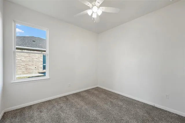 a bathroom with a double vanity sink a toilet and shower