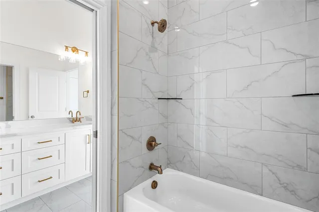 an empty room with wooden floor cabinet and windows