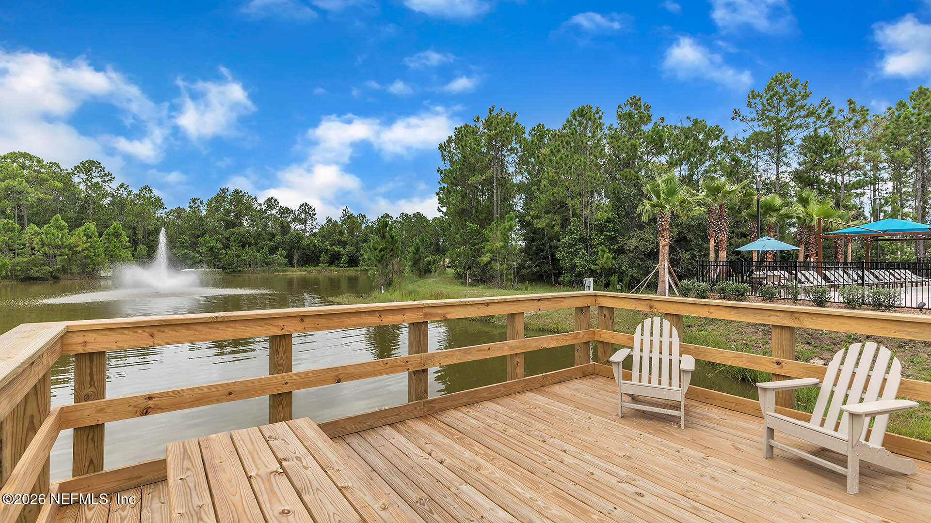 47 Mulligan Way Bunnell, FL 32110 - Photo 27 of 52 a view of a chairs and table on the wooden deck