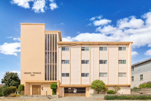 a view of a building with a street