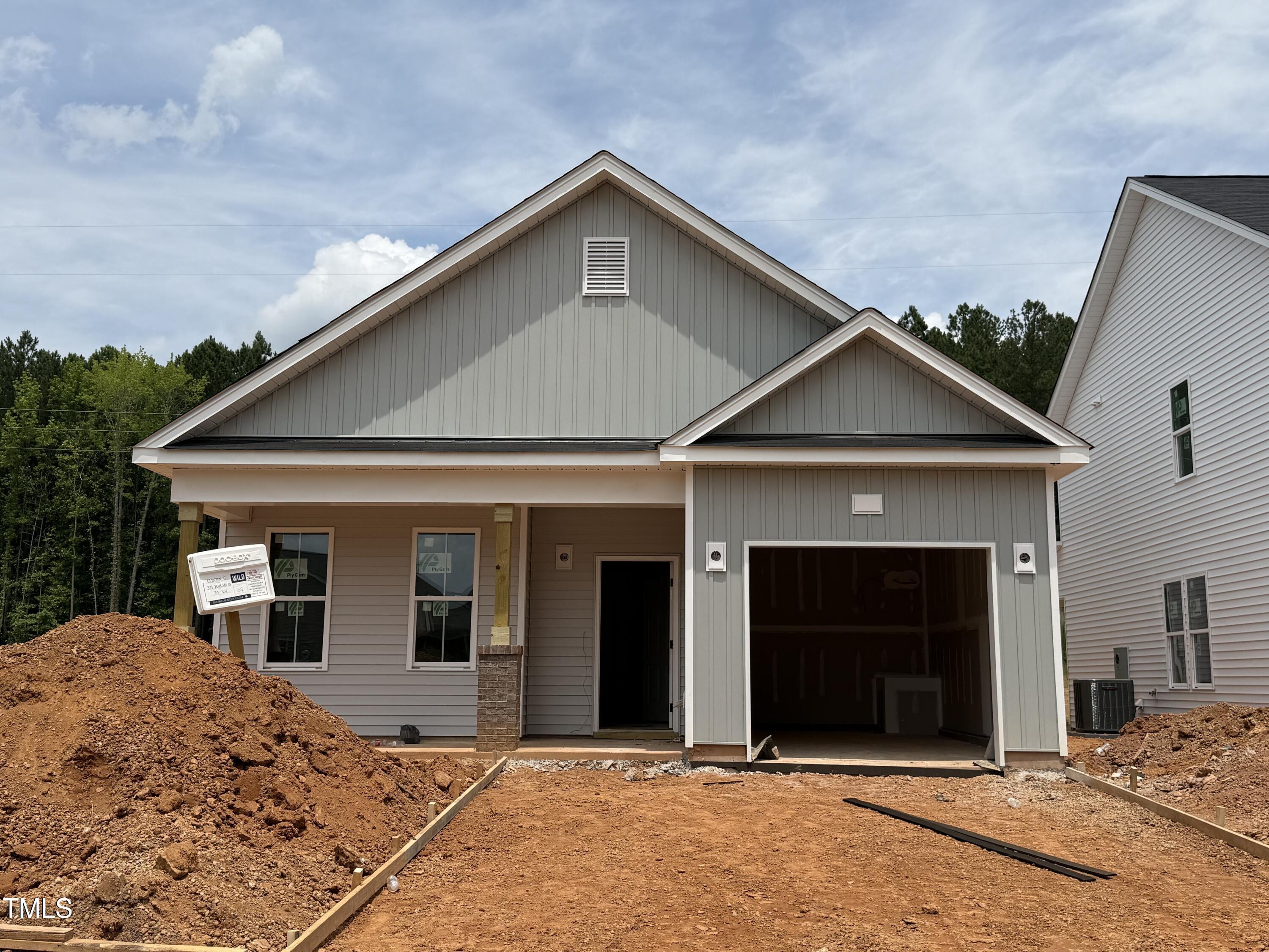 378 Bluejay Street Clayton, NC 27520 - Photo 2 of 13 a front view of a house with a yard