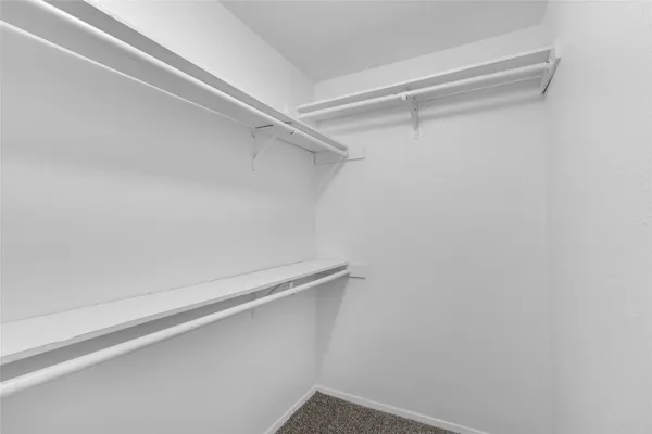 a view of a room with shelf on the wall
