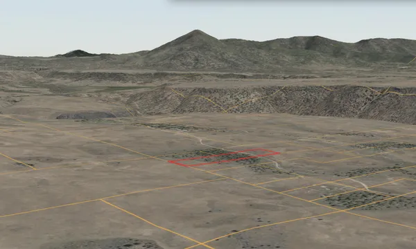 a view of a dry yard with an ocean