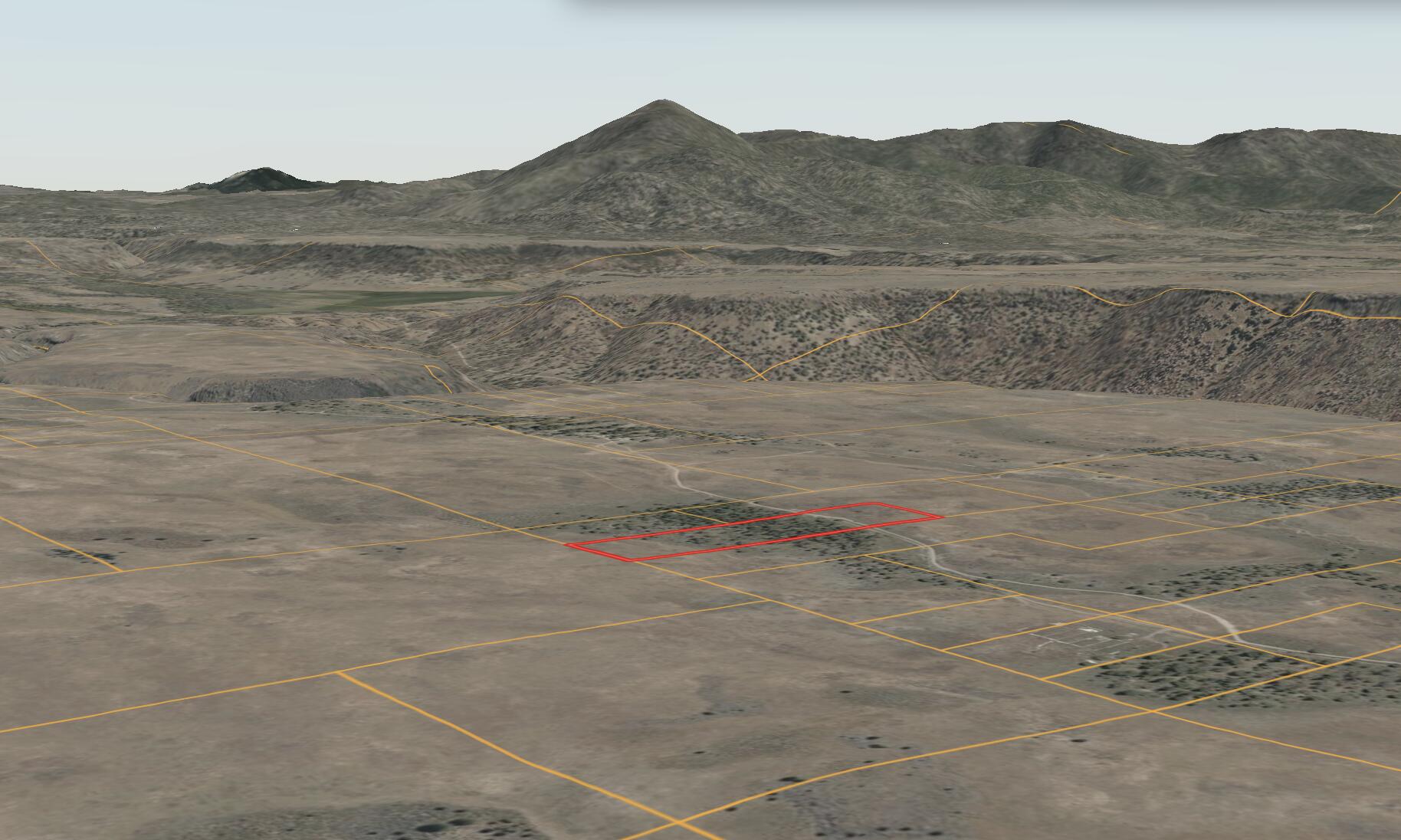 a view of a dry yard with an ocean
