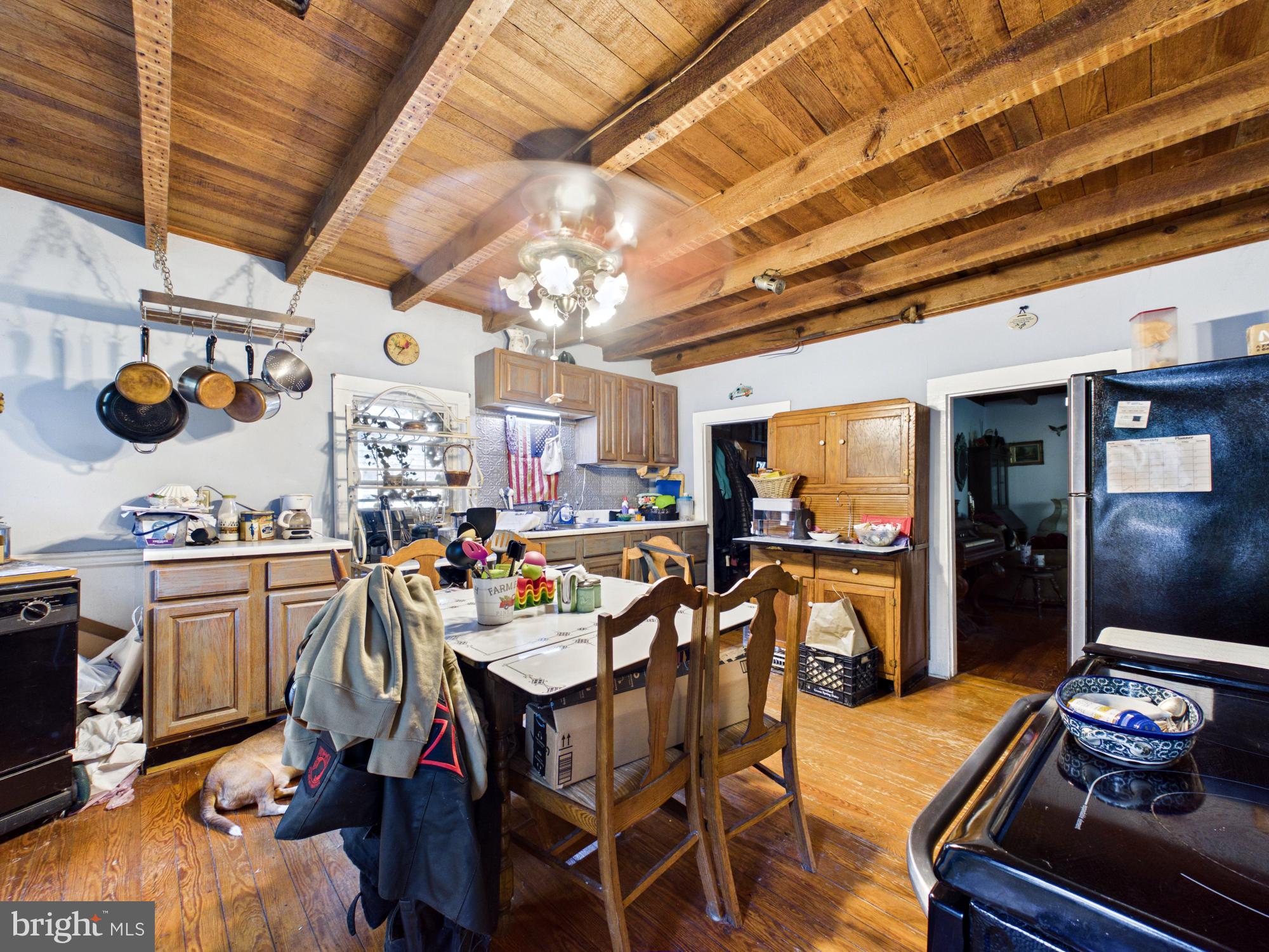 Rustic kitchen with wooden beams.