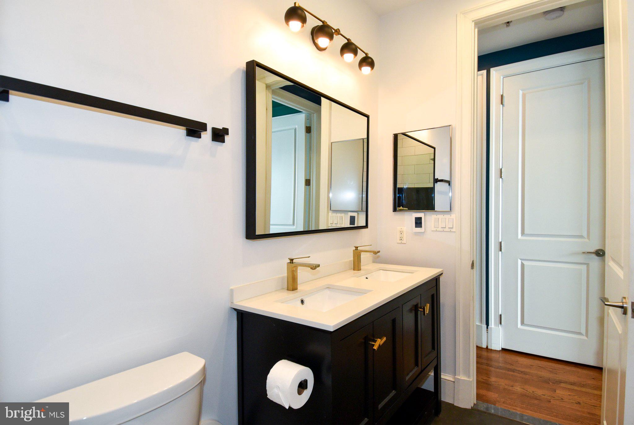 1316 9th Street Northwest Washington, DC 20001 - Photo 20 of 44 Sleek dual vanity in modern bath.