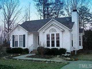 4409 Baldpate Raleigh, NC 27616 - Photo 1 of 1 a front view of a house with a yard and garage