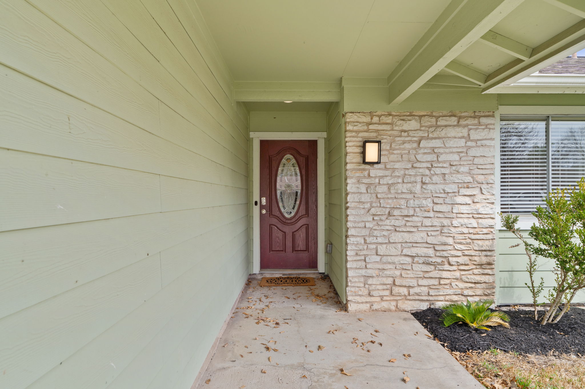 2604 Cockburn Drive Austin, TX 78745 - Photo 11 of 33 A covered entry creates a quiet arrival tucked just off the front drive.