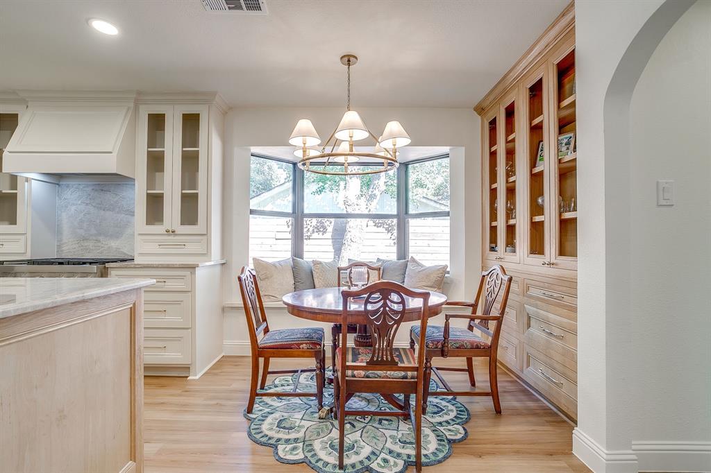4521 Cloudview Road Fort Worth, TX 76109 - Photo 12 of 40 a dining room with furniture a chandelier and wooden floor