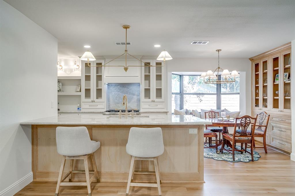 4521 Cloudview Road Fort Worth, TX 76109 - Photo 13 of 40 a kitchen with stainless steel appliances granite countertop a table and chairs in it