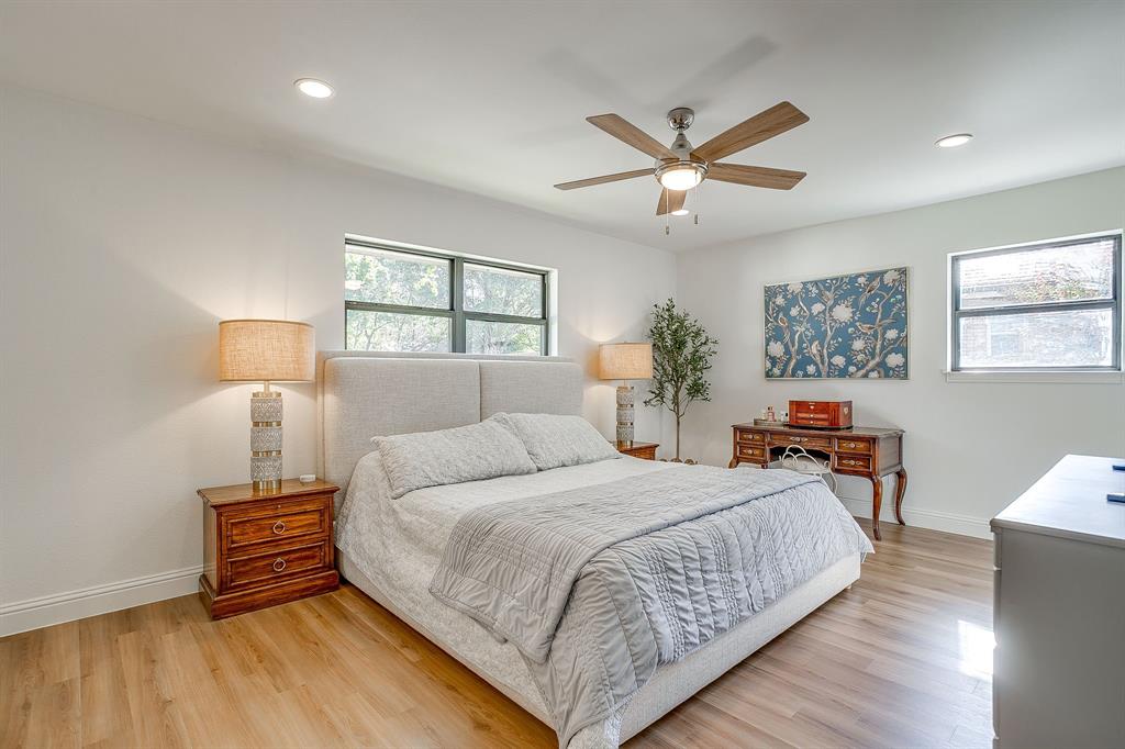 4521 Cloudview Road Fort Worth, TX 76109 - Photo 22 of 40 a bedroom with a bed and wooden floor
