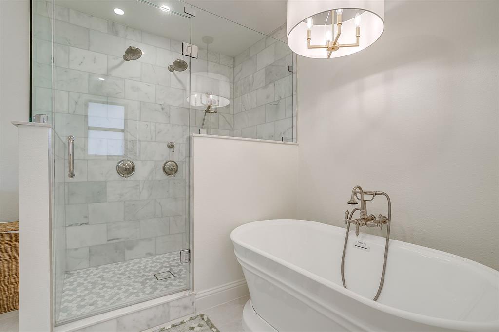 4521 Cloudview Road Fort Worth, TX 76109 - Photo 25 of 40 a bathroom with a white bath tub and a shower