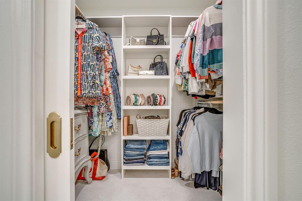 4521 Cloudview Road Fort Worth, TX 76109 - Photo 26 of 40 a view of walk in closet with clothes and shoes