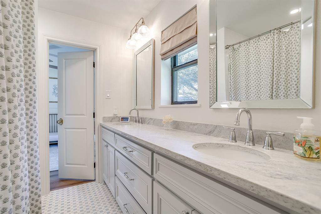 4521 Cloudview Road Fort Worth, TX 76109 - Photo 31 of 40 a bathroom with a granite countertop sink mirror and double