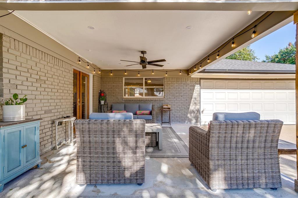 4521 Cloudview Road Fort Worth, TX 76109 - Photo 35 of 40 a living room with furniture a window and a flat screen tv