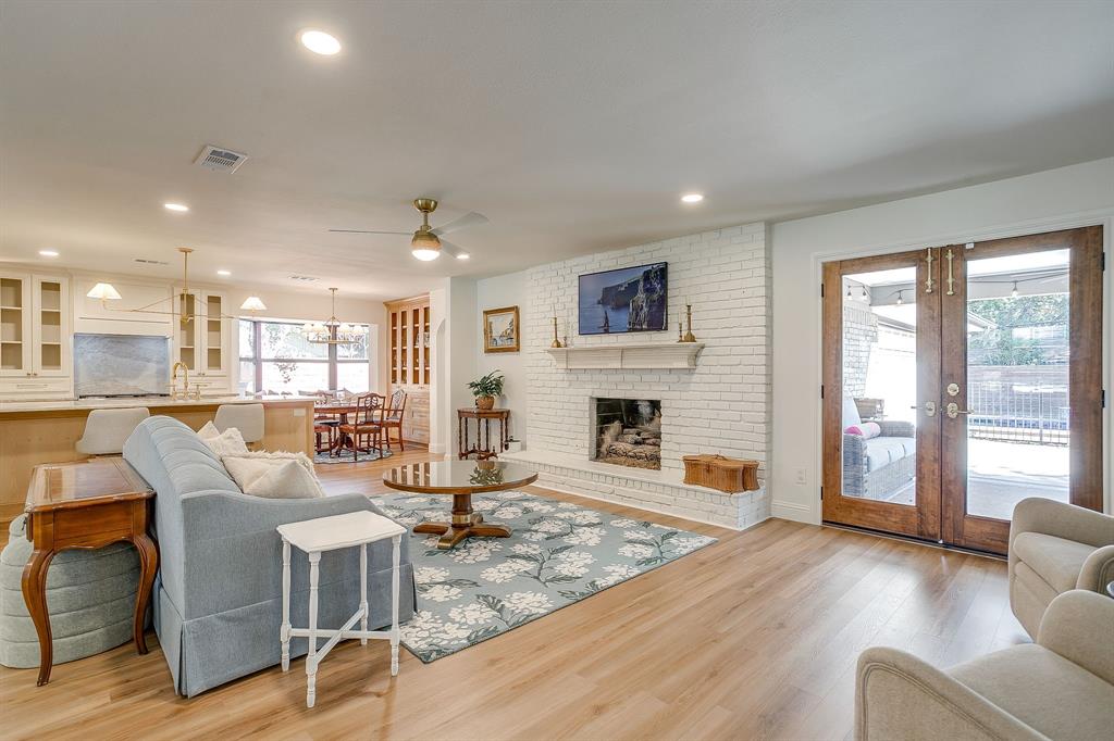 4521 Cloudview Road Fort Worth, TX 76109 - Photo 8 of 40 a living room with fireplace furniture and a wooden floor