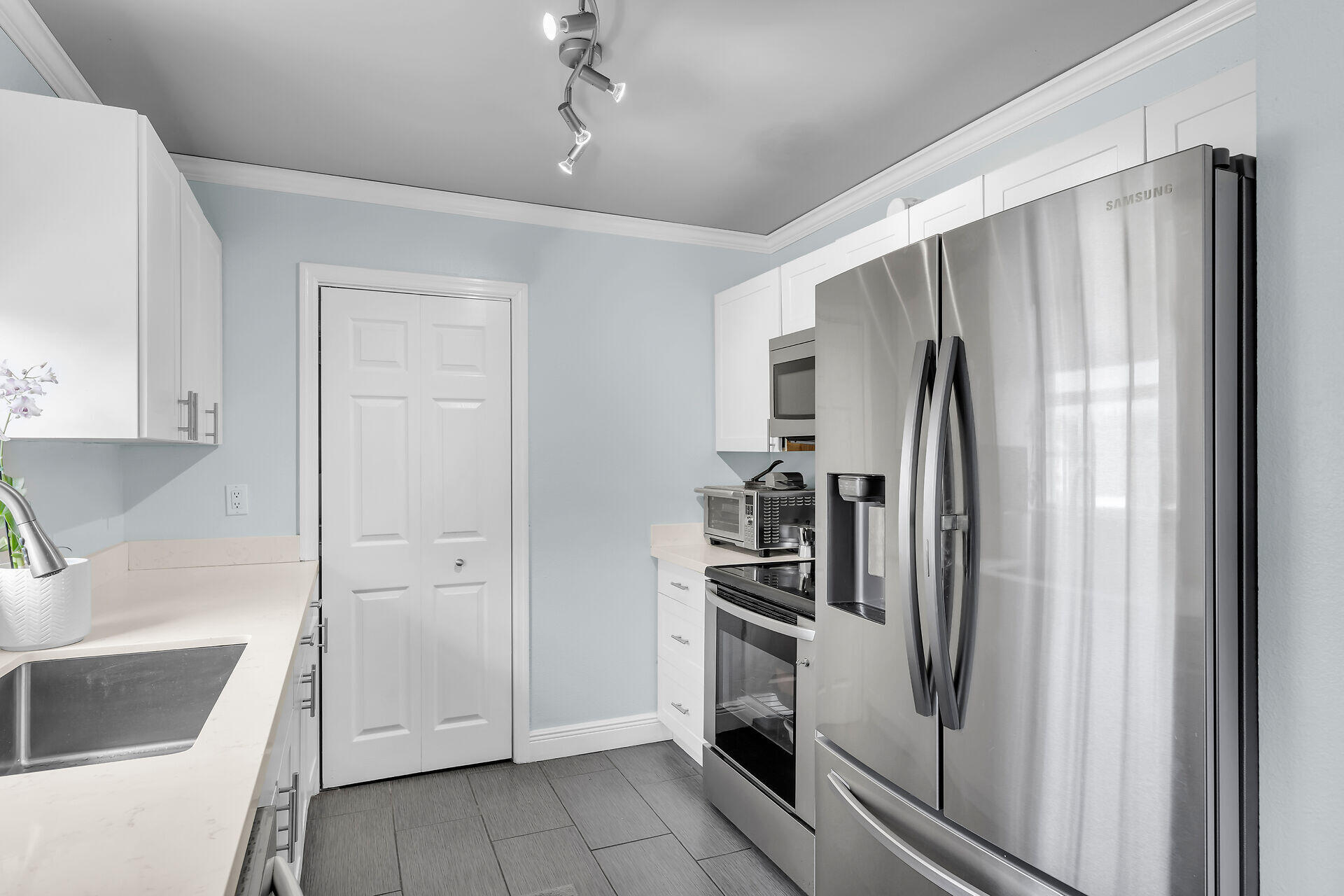 38 Calle Uno Key West, FL 33040 - Photo 9 of 13 a kitchen with stainless steel appliances a refrigerator and a sink