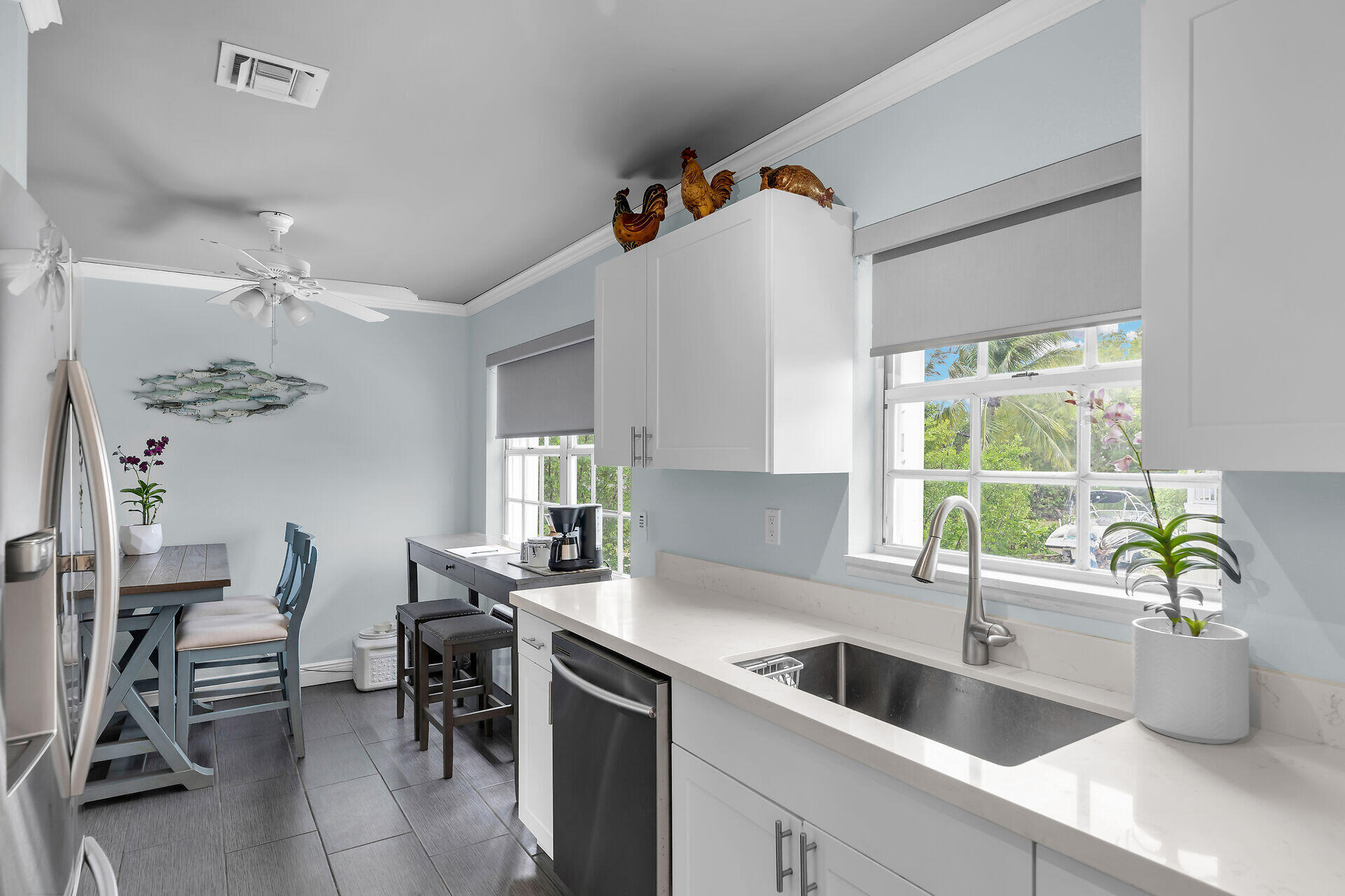 38 Calle Uno Key West, FL 33040 - Photo 10 of 13 a kitchen with a sink and a refrigerator