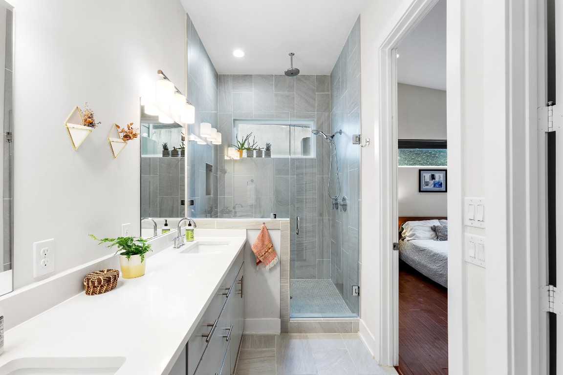 3101 Sunnylawn Circle, Unit B Austin, TX 78723 - Photo 12 of 28 Ensuite bathroom with stylish light fixtures and walkin shower
