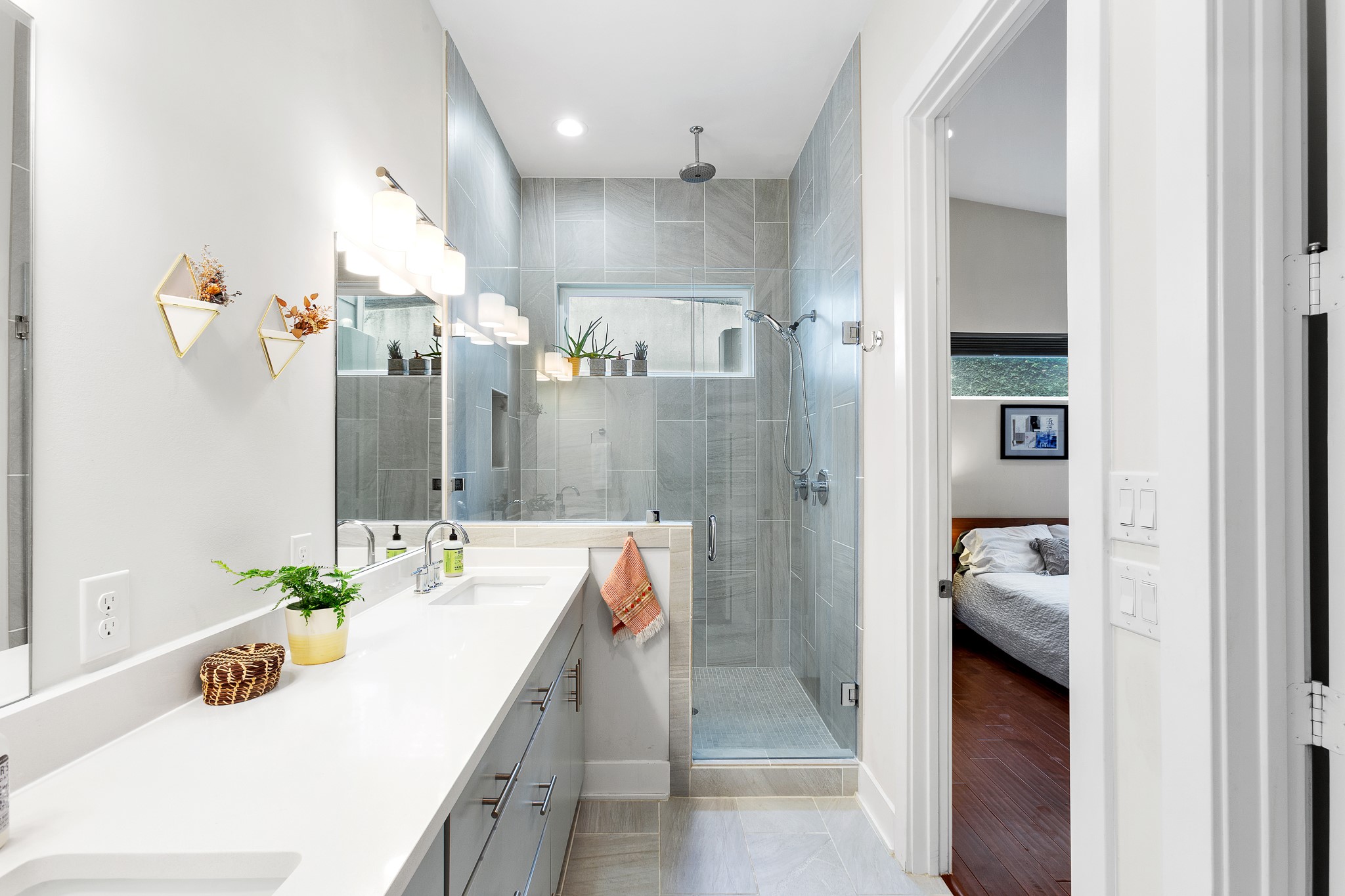 3101 Sunnylawn Circle, Unit B Austin, TX 78723 - Photo 13 of 32 Ensuite bathroom with stylish light fixtures and walkin shower