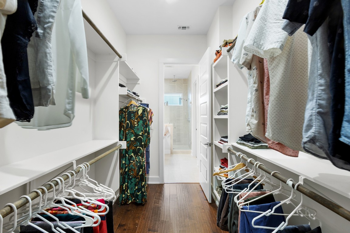 3101 Sunnylawn Circle, Unit B Austin, TX 78723 - Photo 13 of 28 Generous walk in closet featuring dark wood-style flooring